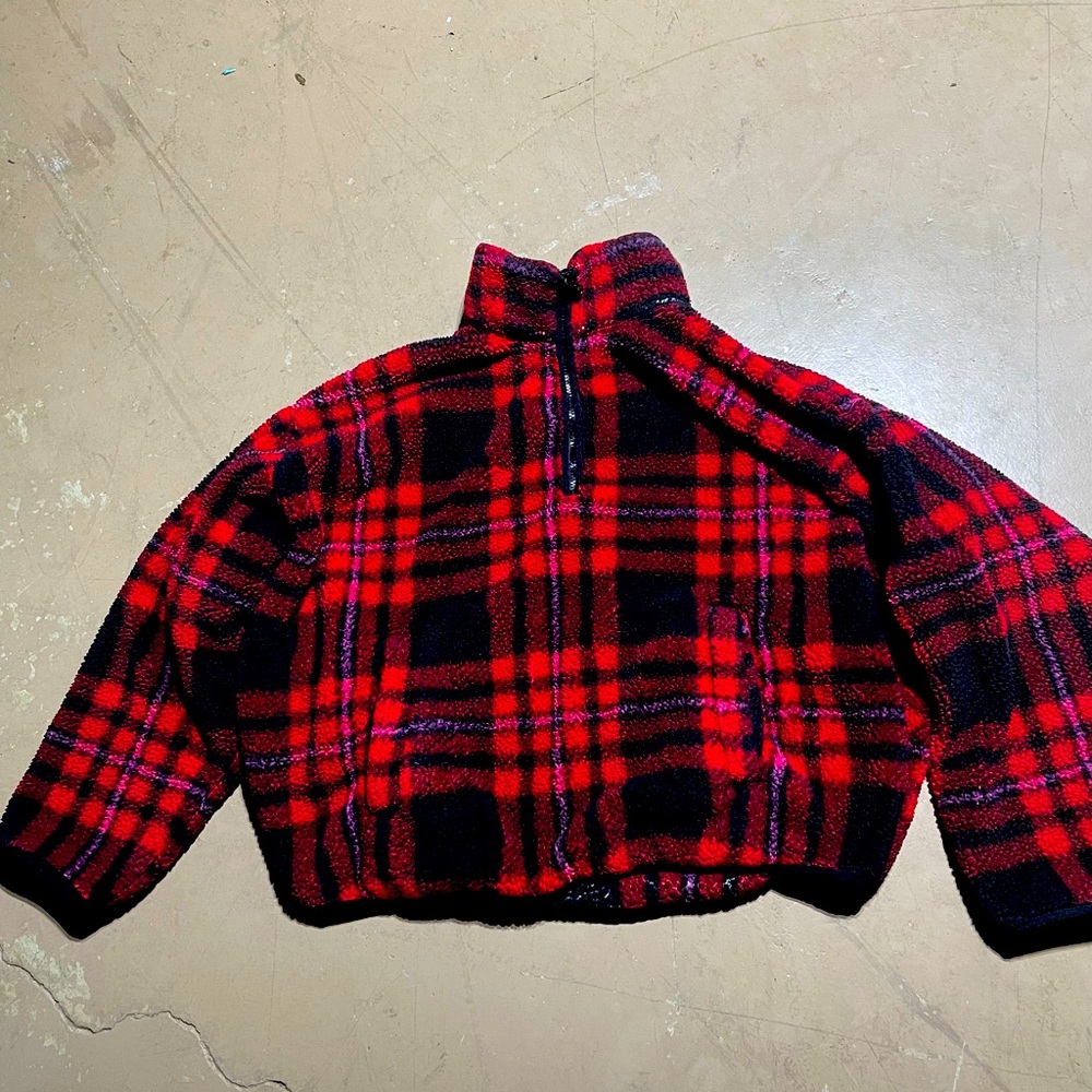 A red and black plaid sweater
